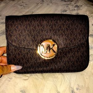 MK clutch bag missing the strap.